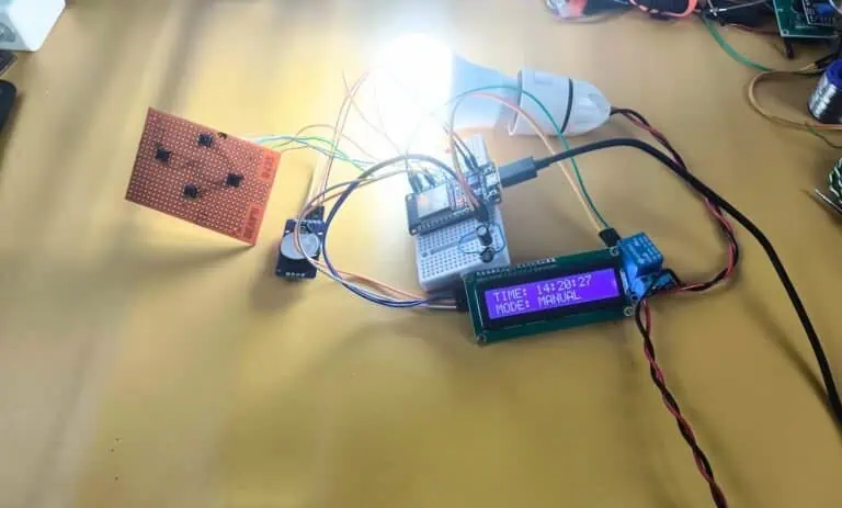 A functional automatic on off timer switch prototype built with ESP32, DS3231 RTC, and a relay, controlling an AC light bulb.