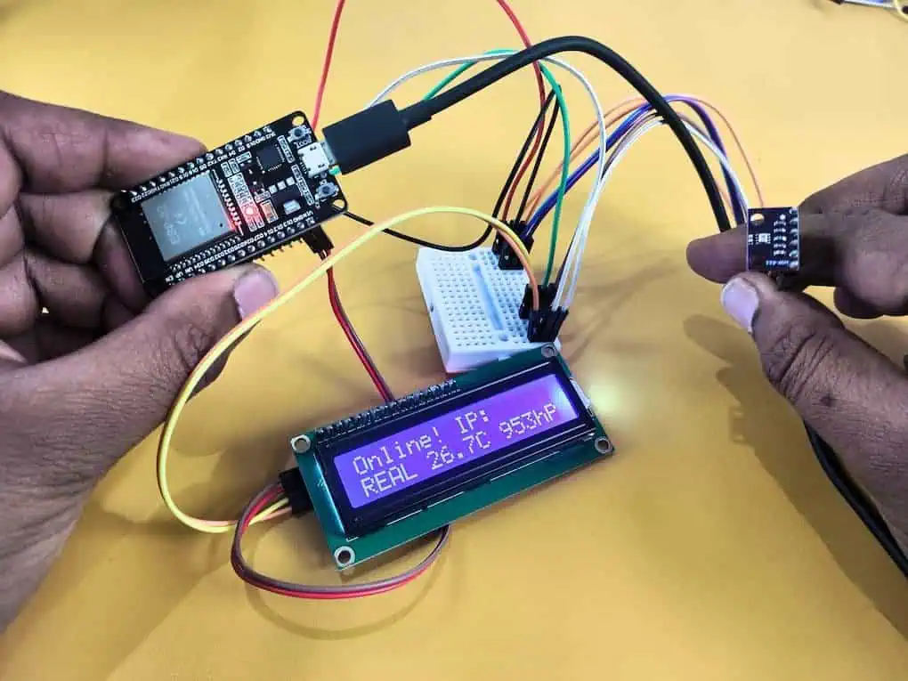 A real-world test of a bmp280 barometric sensor connected to an ESP32, with the LCD screen displaying live local temperature and atmospheric pressure readings.