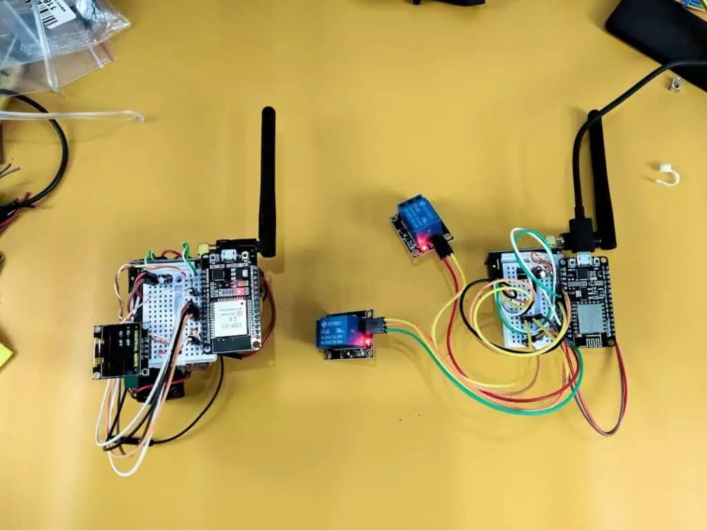 Workbench test of long-range ESP32 and NodeMCU wireless relays using NRF24L01 PA+LNA modules to solve ghost switching issues.