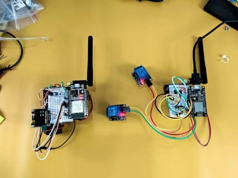 Workbench test of long-range ESP32 and NodeMCU wireless relays using NRF24L01 PA+LNA modules to solve ghost switching issues.